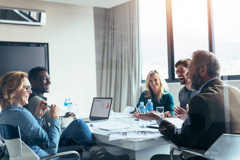 Marketers discuss Marketo Engage and Bizible around office computer