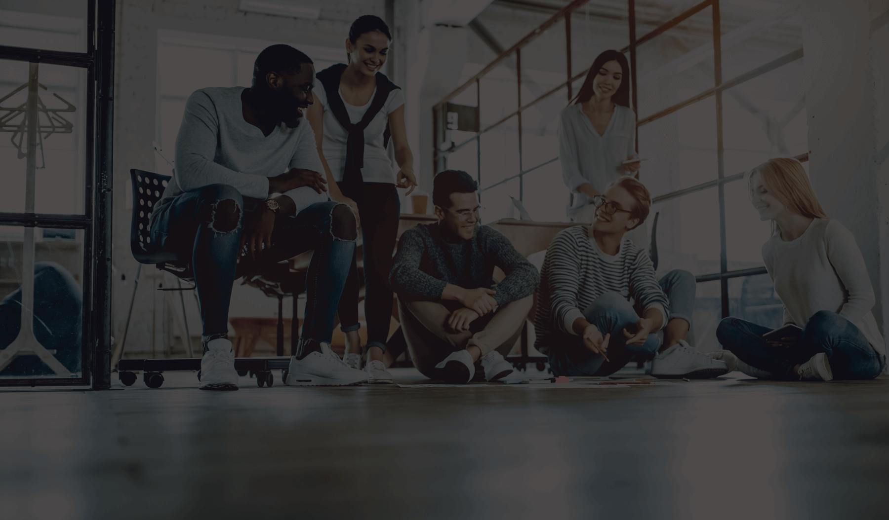employees sitting on the floor in the office