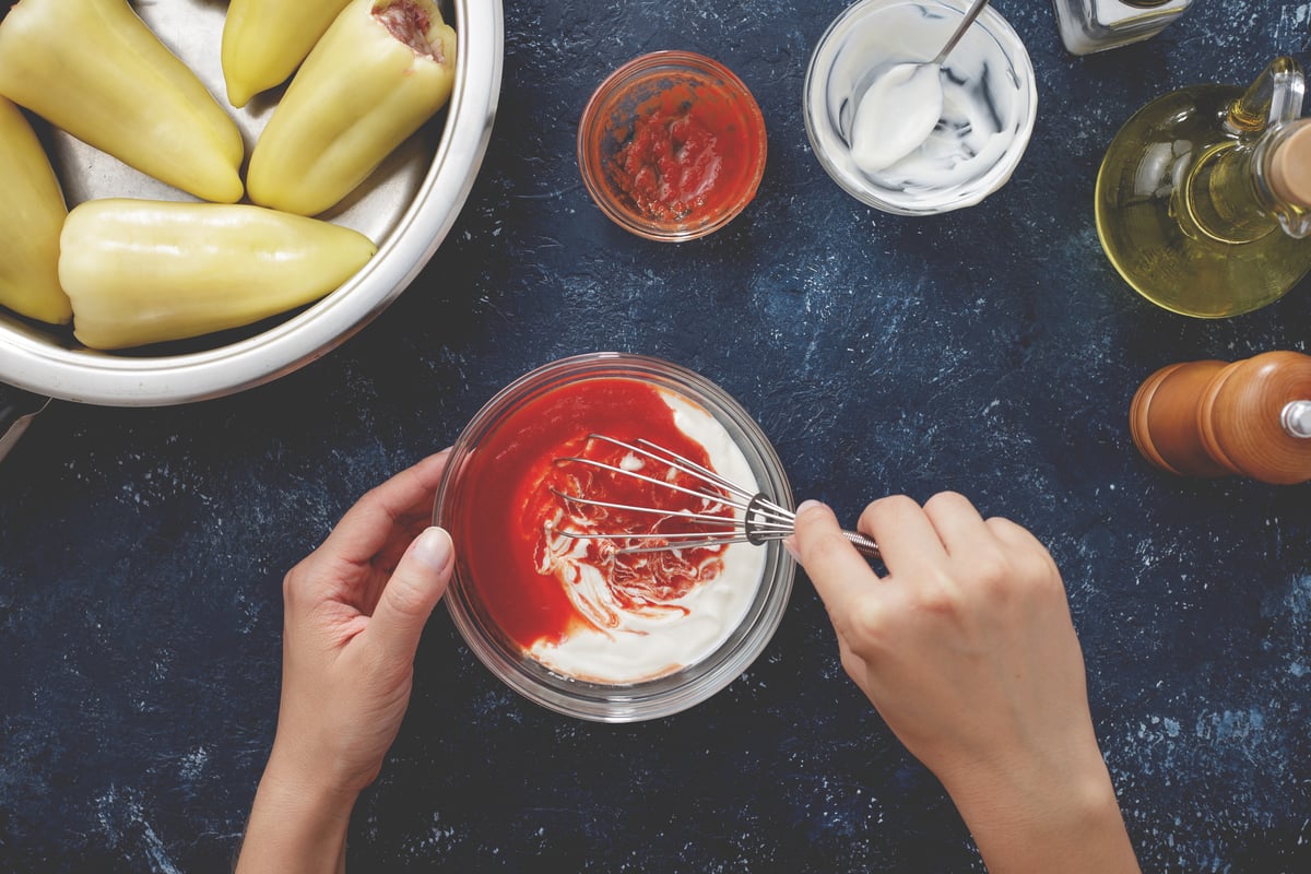 Mixing up some sauce on a table