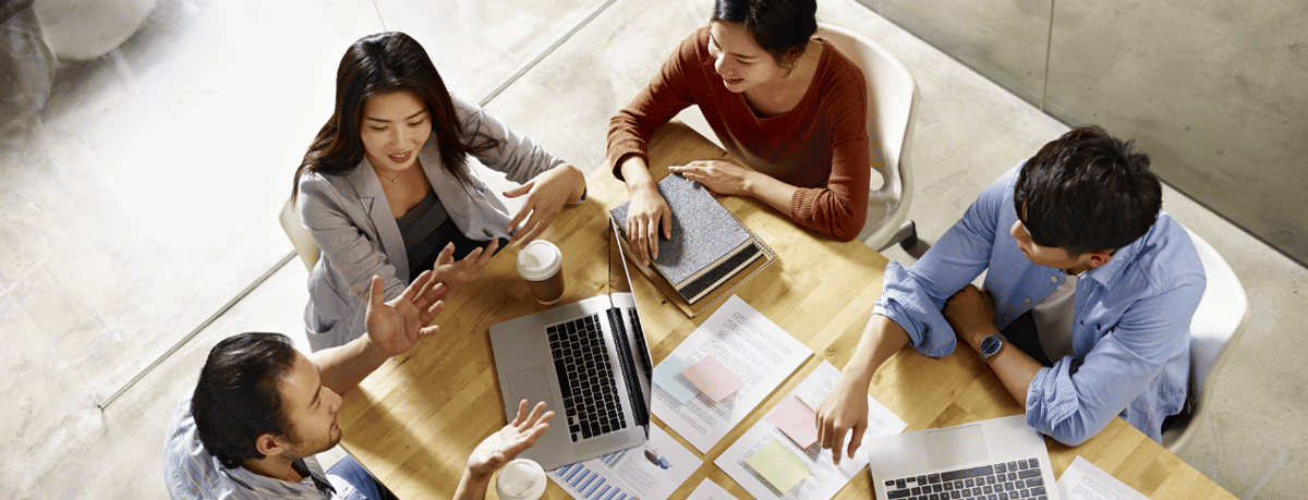 Overhead shot of employees at a desk