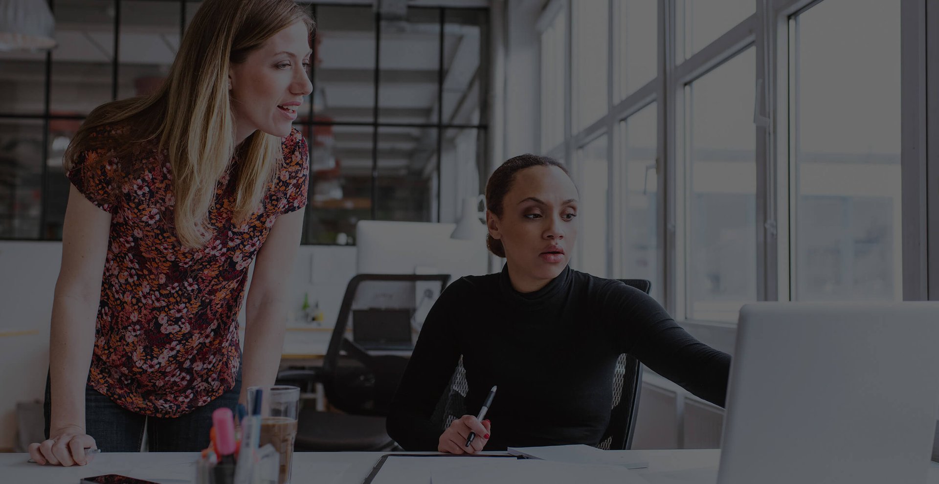 Employees strategizing at their desk