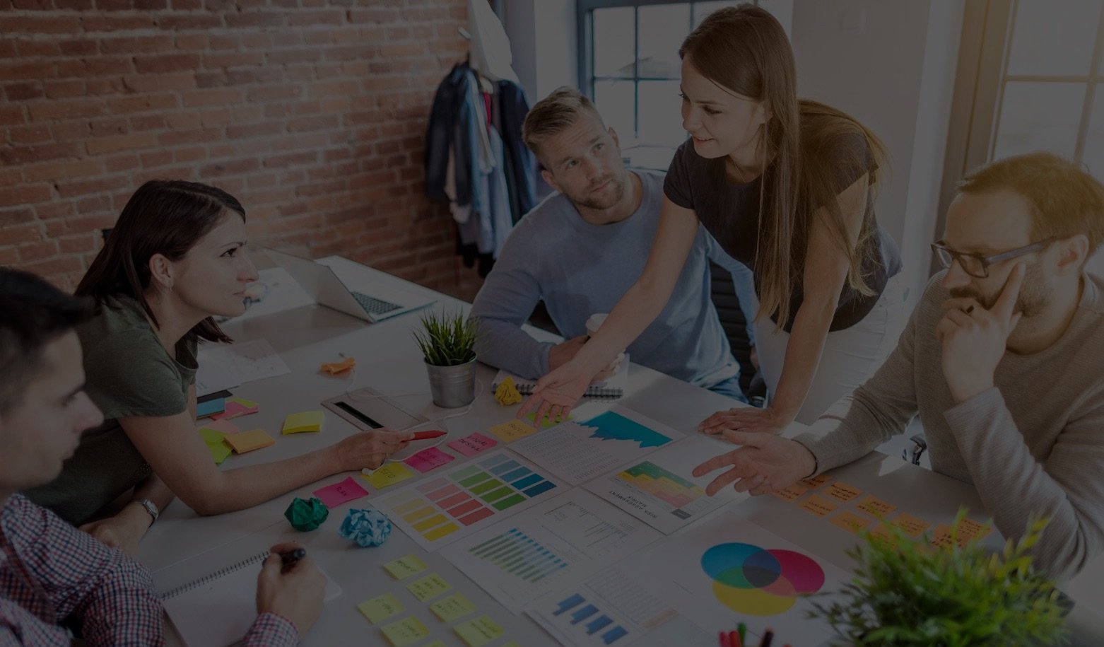 Employees strategizing at a desk