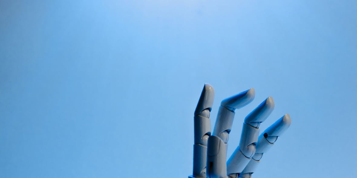 Robotic hand reaching up in the air