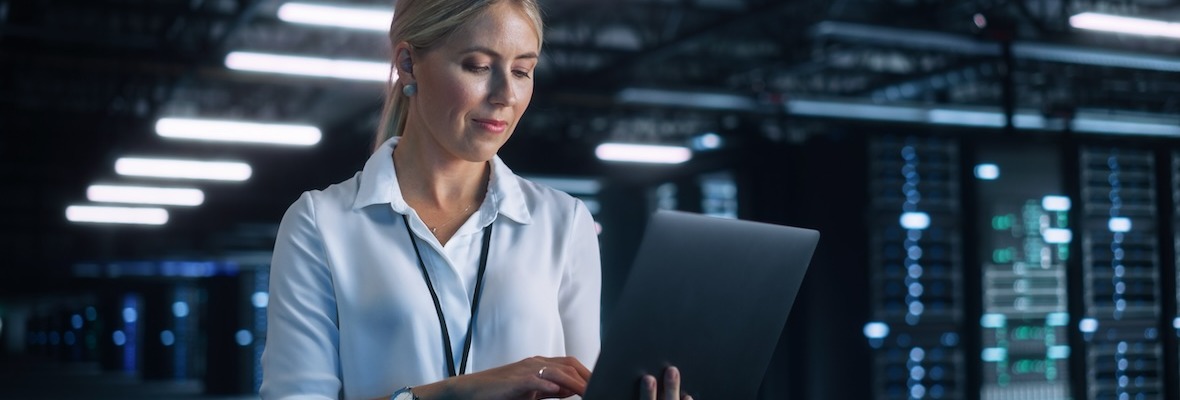 Portrait of Successful Female Chief Engineer or CEO Using Laptop Computer