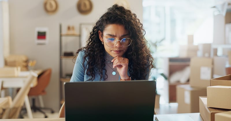 woman on laptop conducting her own ecommerce cro audit