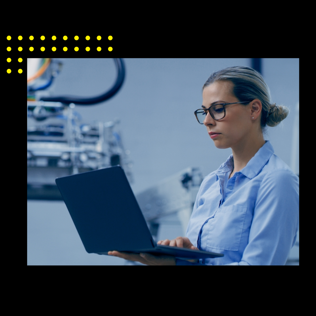 Laptop and woman in automation lab for research, analytics and machine inspection. Futuristic technology, industry 4.0 and female engineer on computer for report, data and robotic system