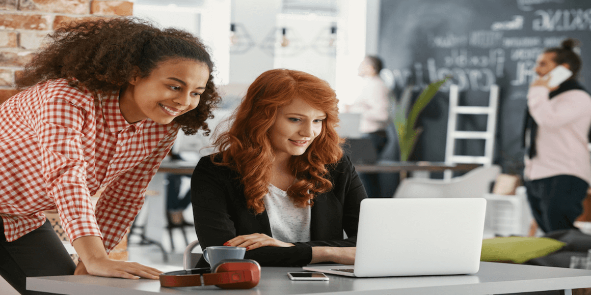 Two people working on their Desk