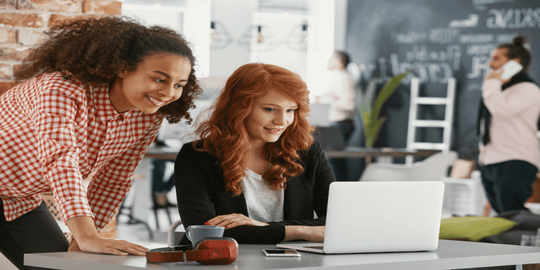 Two people working on their Desk