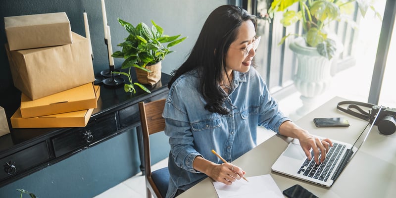 eCommerce marketer creating emails on laptop