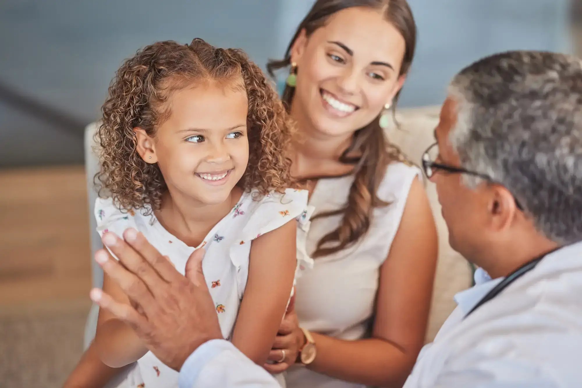 Doctor highfiving a little girl