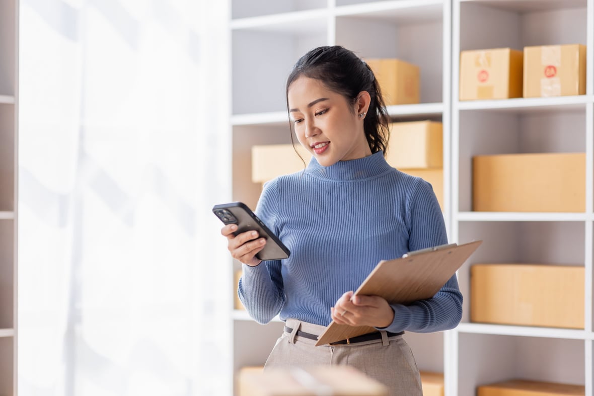 Asian woman looking at her phone