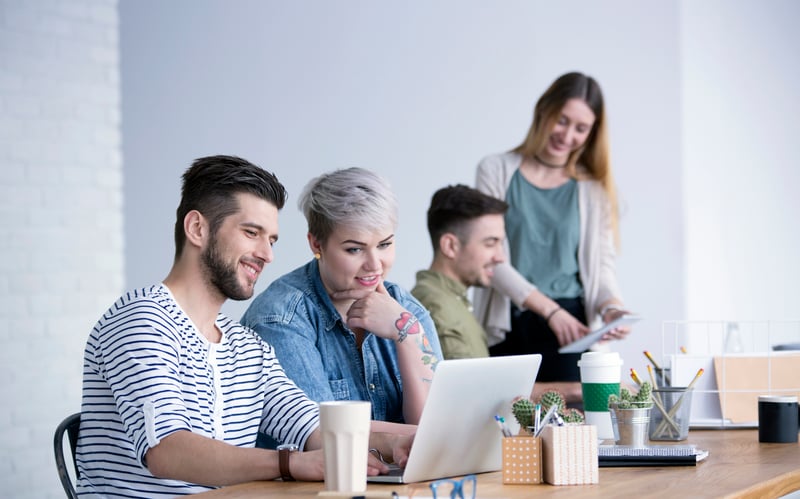 Marketers looking at a computer