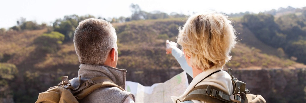 Man and woman hiking an d looking at the horizon