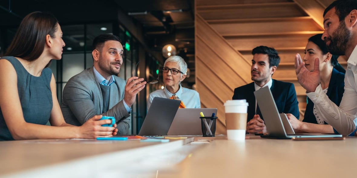 A group of business owners discussing strategies at a table