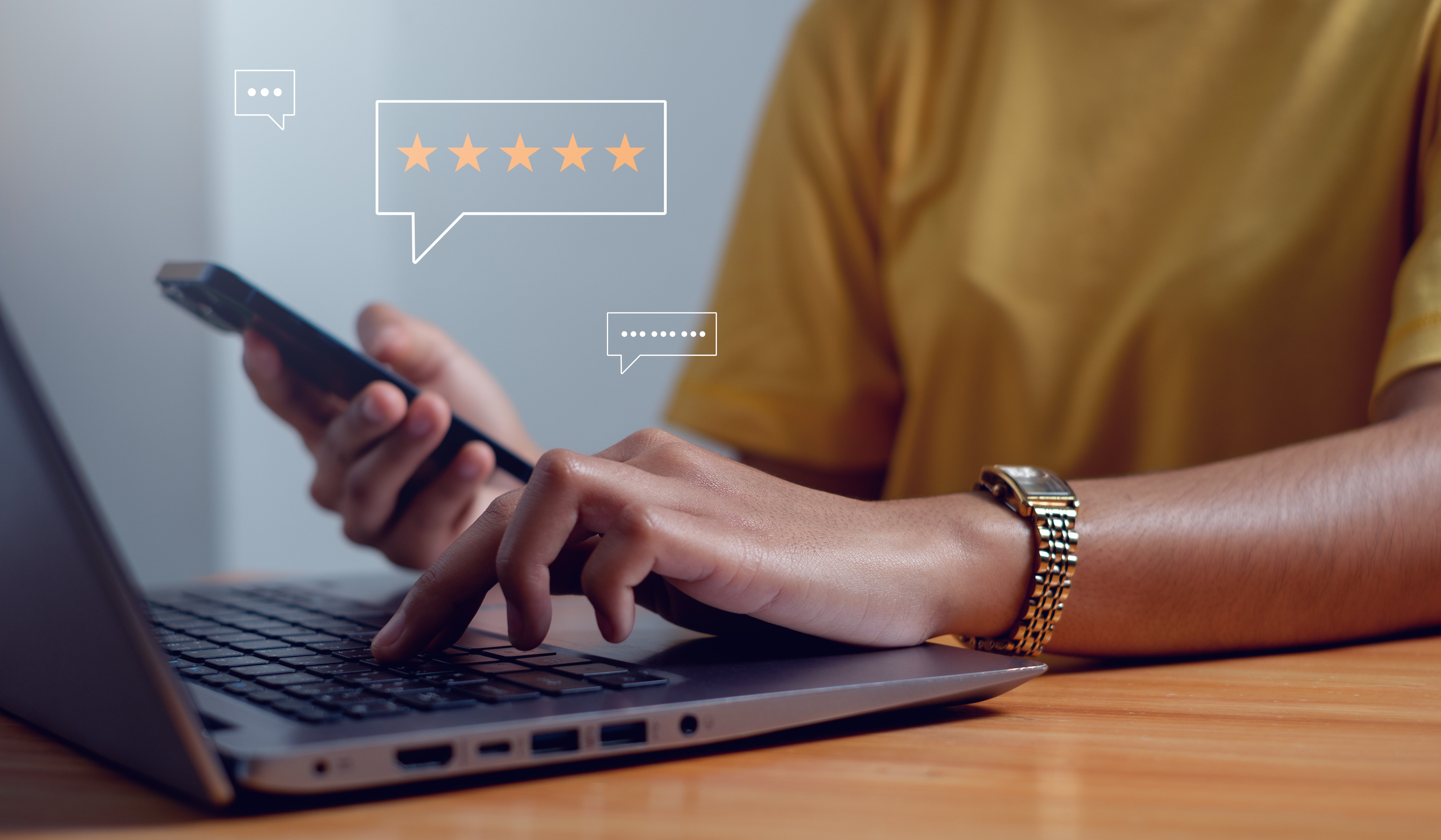 Person on laptop developing a strategy to generate reviews