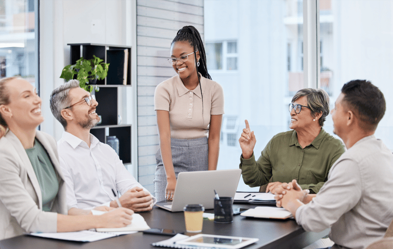 Woman in office explaining the benefits of channel marketing to her CMO