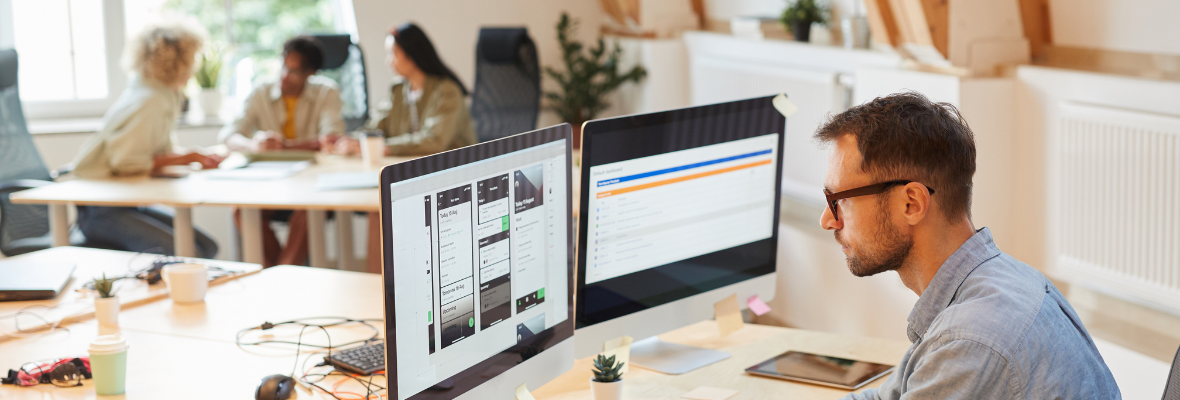 A marketer working on a CRM integration on two screens