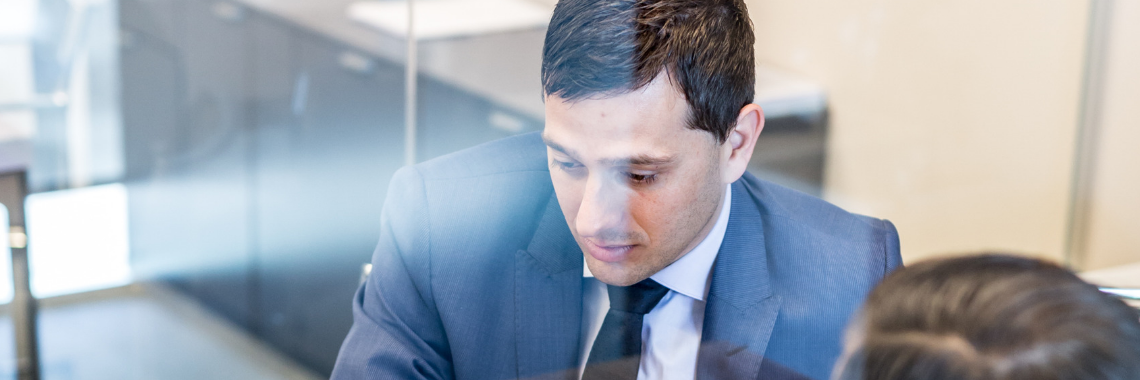 Man looking down at desk