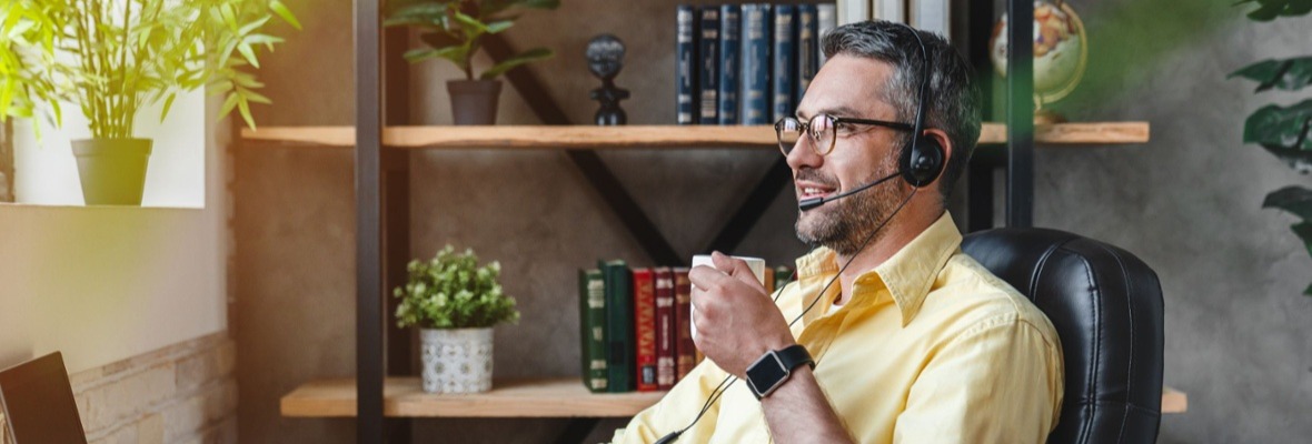 Man on a video call wearing a headset