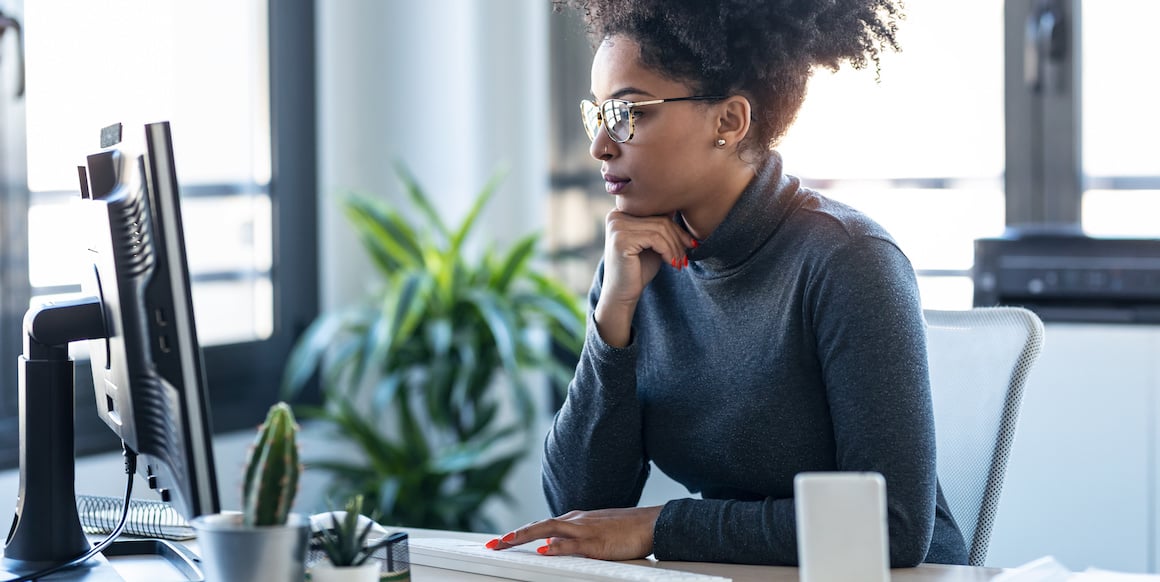 Person looking at computer contemplates what is a good bounce rate for their website after reading a SmartBug Media blog about conversion rate optimization.