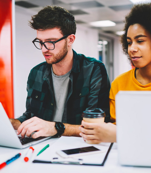 Two coworkers working on a blog together