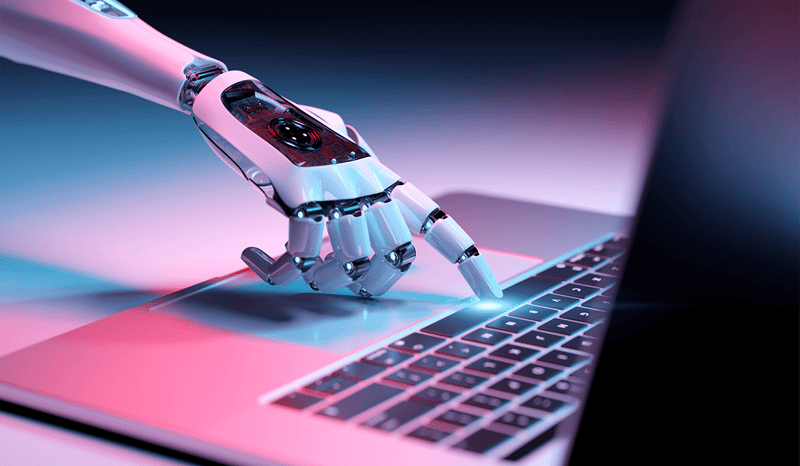 Robot hands on a laptop keyboard