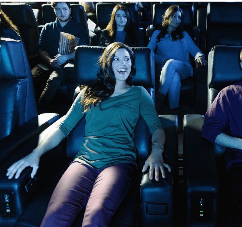 girl enjoying her seat at a theater