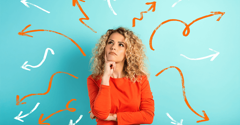 Woman deciding between options with arrows around her
