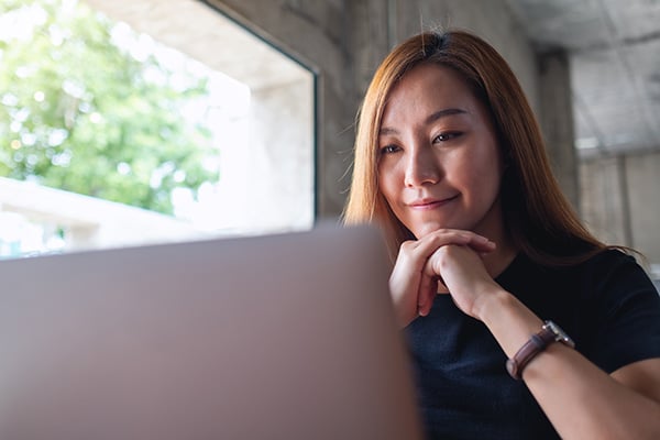 woman-working-laptop-modern-industrial-workspace