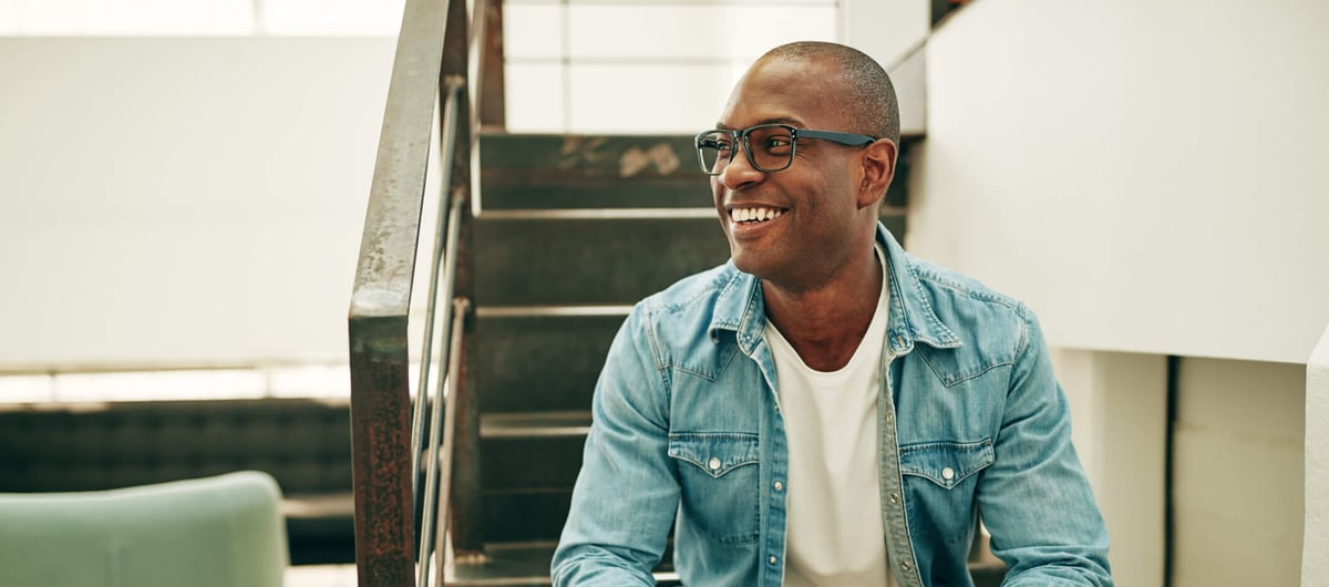 man smiling with glasses