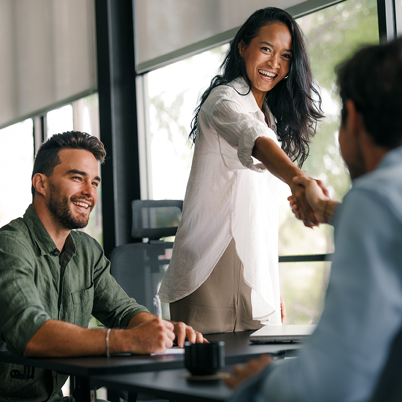 woman shaking hands with recruiter